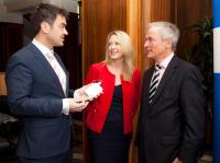 Minister for Jobs, Enterprise and Innovation Richard Bruton, Sarita Johnston of Enterprise Ireland and Neuromod Devices chief executive Dr Ross O’Neill, at the launch of mutebutton, a new treatment device for tinnitus.