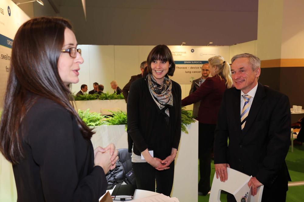 Big Ideas participants Elizabeth Fingleton and Kate Cronin from OBEO explain their offer to Minister Bruton in the Big Ideas zone at the Innovation Showcase.
