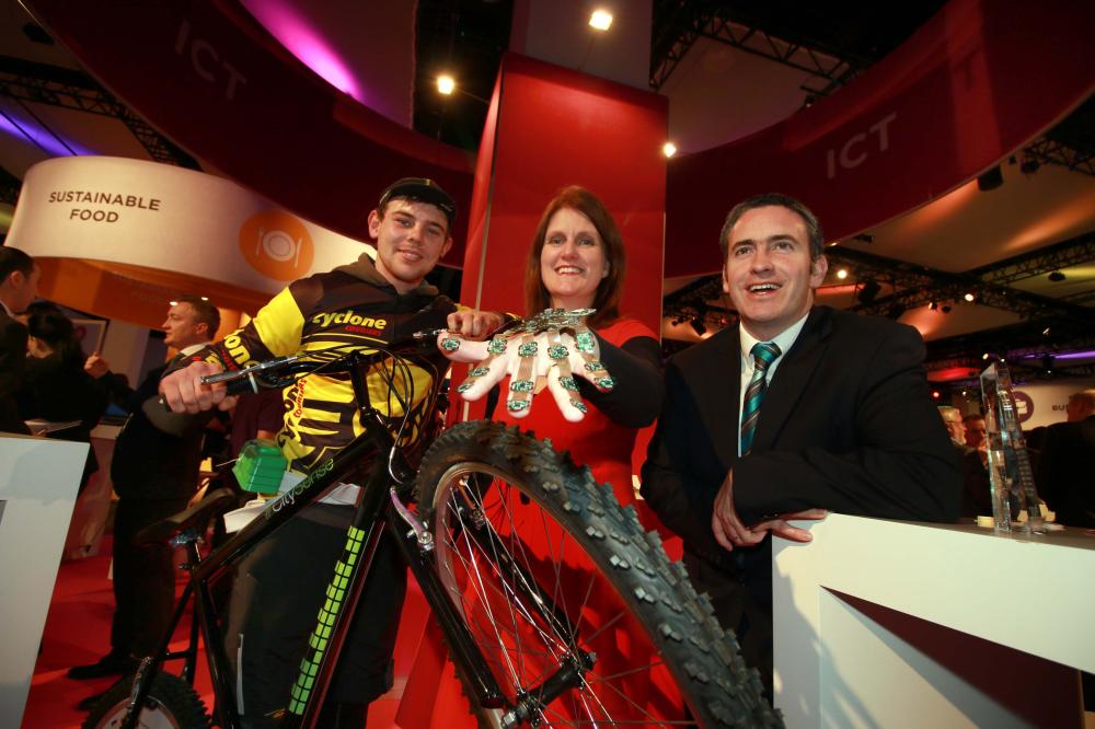 Pictured demonstrating both the Cyclone Couriers 'CitySense Bike' was Fiachra O'Nuallain and with the ‘sensing glove’ used by surgeons in training which has been developed at Tyndall National Institute was Julie Dorel, Tyndall Institute and Damien English T.D. Minister for Research & Innovation