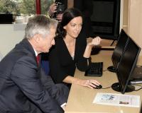 Minister Richard Bruton in Clonakilty Technology Park getting a demo from Dominique Coughlan of Global Shares new software 